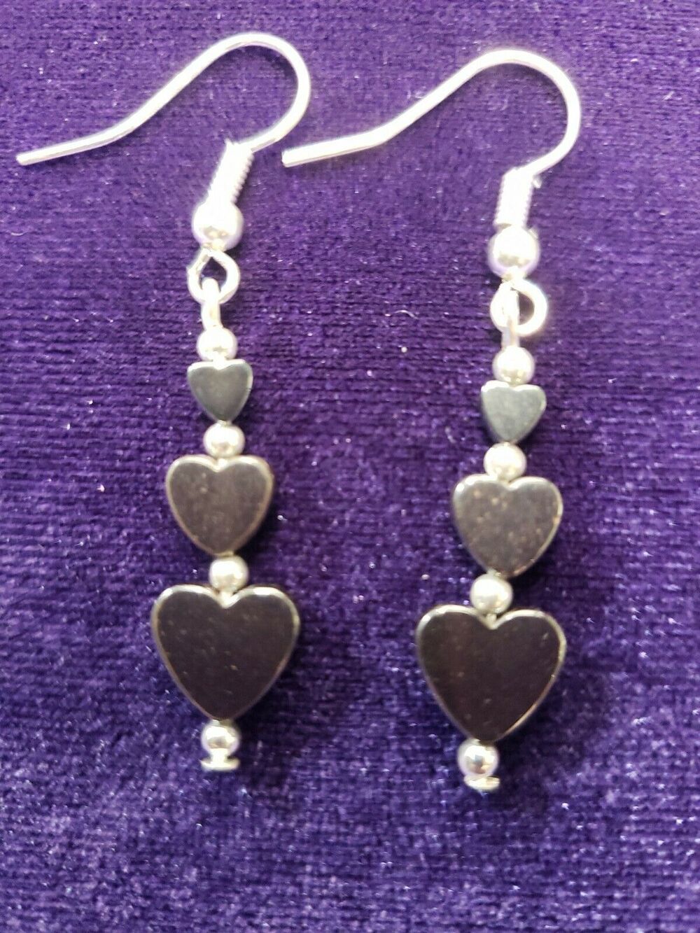 Heart Shaped Hematite and Silver Colored Dangle Earrings Graduating Sizes